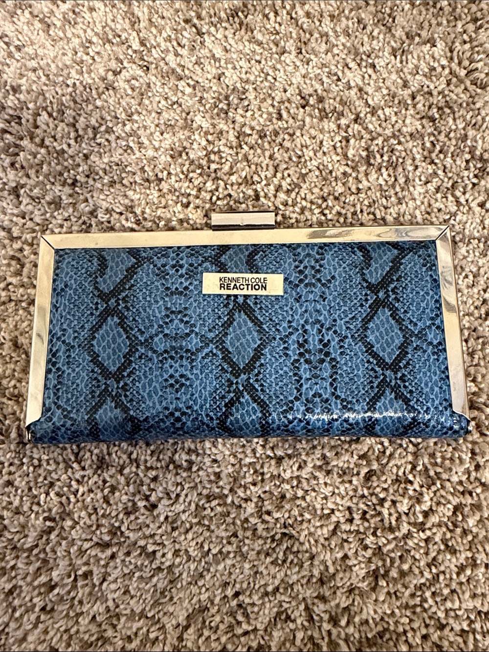 Kenneth Cole Reaction Clutch in blue snakeskin pattern